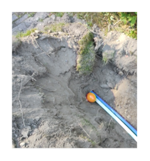 A pipe in the dirt__Description automatically generated